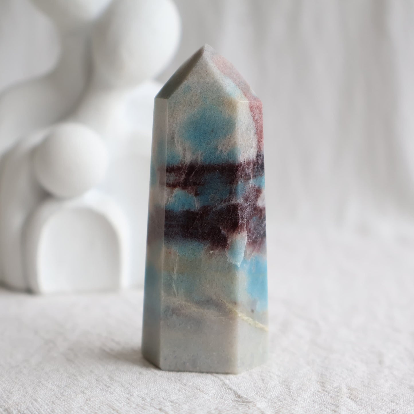 Trolleite crystal towers with vivid blue, burgundy red and cream mineral patterning, polished into generator tower points