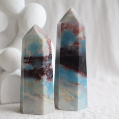 Trolleite crystal towers with vivid blue, burgundy red and cream mineral patterning, polished into generator tower points