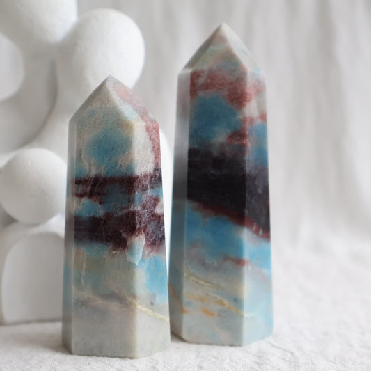 Trolleite crystal towers with vivid blue, burgundy red and cream mineral patterning, polished into generator tower points