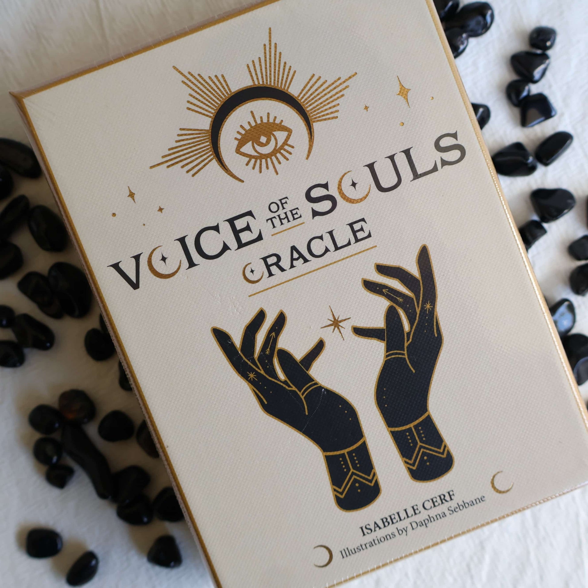Voice of the Souls Oracle card deck by Isabelle Cerf with elegant black and gold artwork on a cream box and accompanying guidebook.