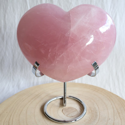 XXL rose quartz puffy heart crystal on stand with soft blush pink colouring, natural clouding and polished finish.